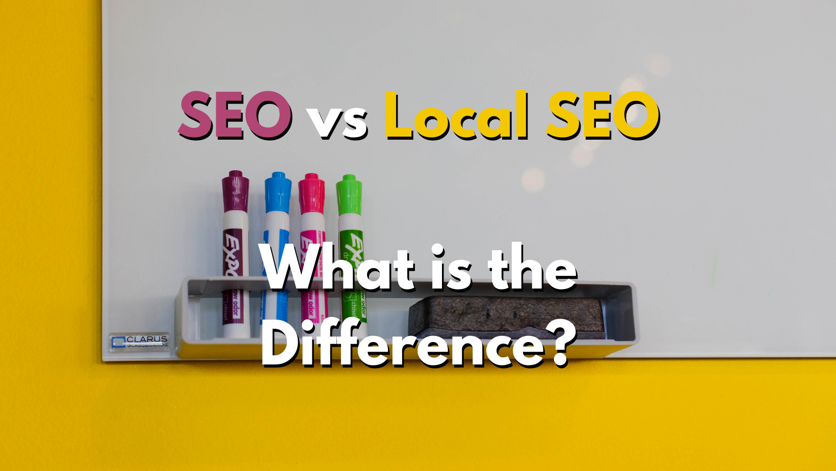 A blank whiteboard with markers and an eraser. The words "SEO vs Local SEO - what is the difference?" is imposed on it.